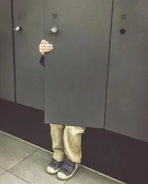 Boy hides in the closet Stock Photos