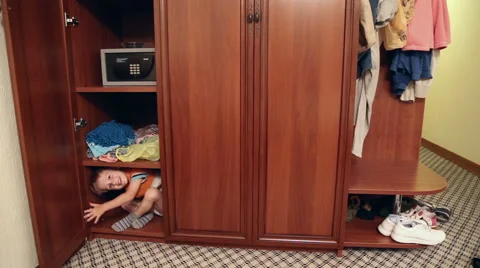 The boy is hiding in the closet Stock Footage 52771421