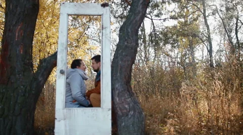 Boy with his girlfriend having fun outside on golden hill. Young couple have fun Stock Footage 65467093