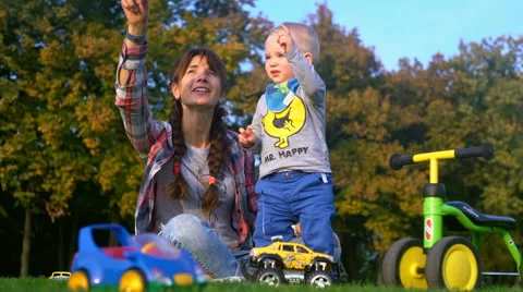 Boy With His Mother Looking in the Sky Showing the Plane Stock Footage 68102166