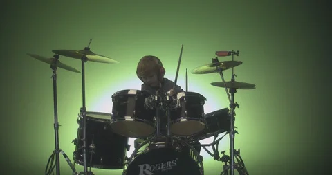 Boy hit crash cymbal with drum stick in slow motion Stock Footage 99990266