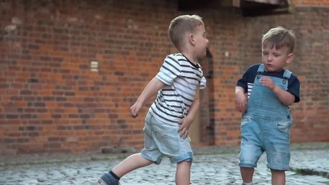 Boy hitting another boy  Stock-Footage 79927276