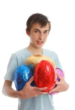 Boy holding 4 large easter eggs Stock Photos