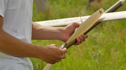 Boy is Holding Aircraft Model at Competition Outdoors Konotop Ukraine 動画素材 64580469