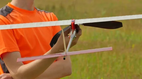 Boy is Holding Aircraft Model Looking Somewhere Sports Competition Preparation Stock Footage 64580426