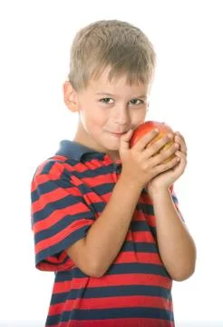 Boy holding an apple Stock Photos