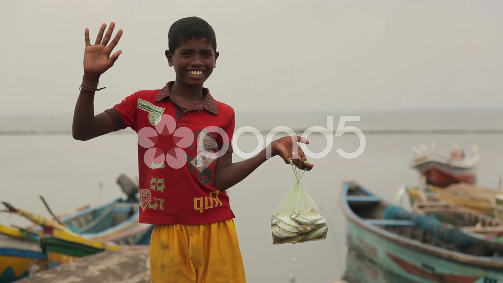 https://images.pond5.com/boy-holding-bag-fish-and-footage-049365996_prevstill.jpeg