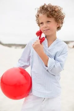 Boy holding ball Stock Photos