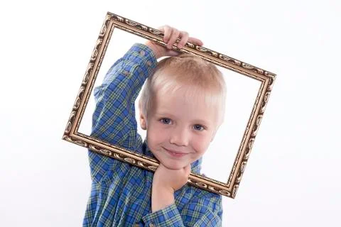Boy holding frame Stock Photos