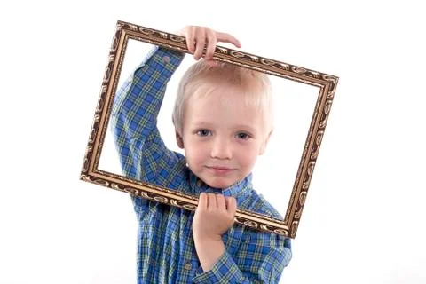 Boy holding frame Stock Photos