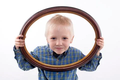 Boy holding frame Stock Photos
