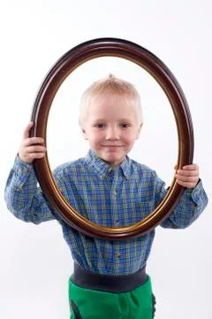 Boy holding frame Stock Photos