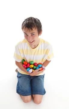 Boy holding lots of easter eggs Stock Photos