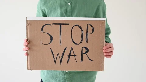Boy holding poster with "Stop War" text Video stock 172321732