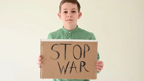 Boy holding poster with "Stop War" text Stock Footage 172322388