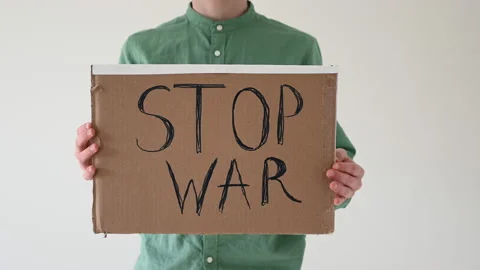 Boy holding poster with "Stop War" text Stock Footage 172322684