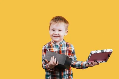 Boy holding present Stock Photos