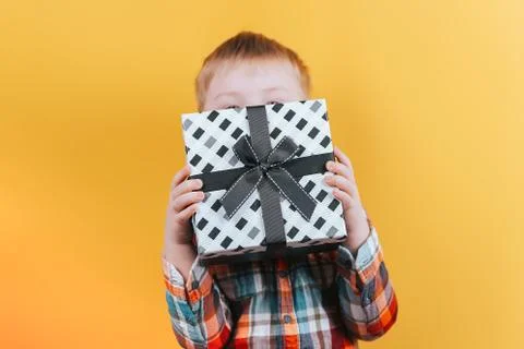 Boy holding present Stock Photos