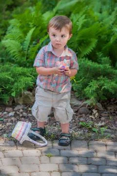 Boy Holding a Purple Easter Egg Stock Photos