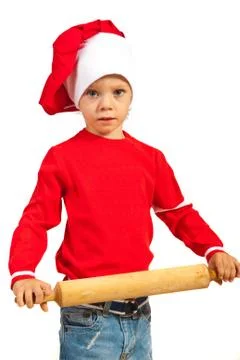 Boy holding rolling pin Foto stock