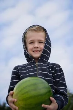 Boy holding water melon Stock Photos