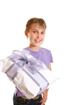 A boy holding a wrapped present Foto stock