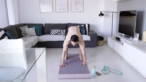 Boy at home doing aerobic exercise Stock Footage 130981391
