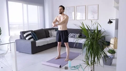 Boy at home doing aerobic exercise Stock Footage 130981419