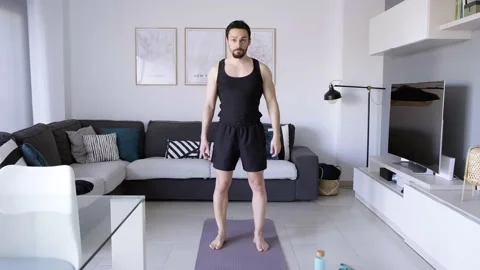Boy at home doing aerobic exercise Stock Footage 130981434