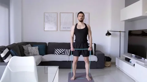 Boy at home doing aerobic exercise Stock Footage 130981466