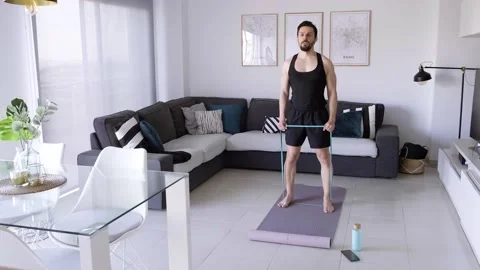 Boy at home doing aerobic exercise Stock Footage 130981475