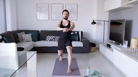 Boy at home doing aerobic exercise Stock Footage 130982471
