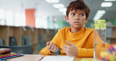 Boy, homework and counting for math at library in school with notebook for Stock Footage 280461163