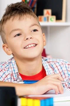 Boy homework at table Stock Photos