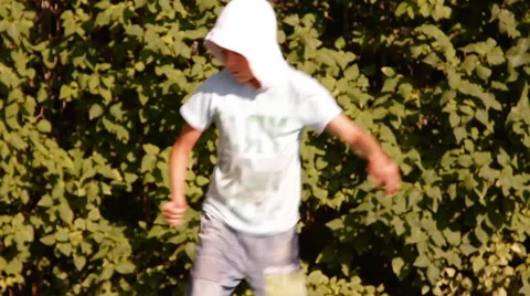 Boy in the hood are dancing, nature, summer day Video stock 45406768