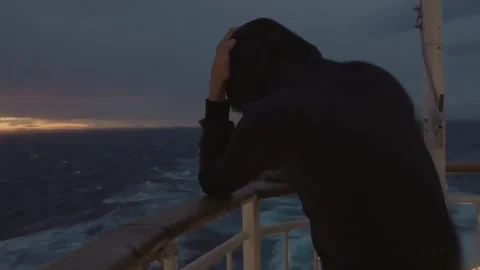 Boy in Hooded Jacket on the Aft Deck of a Ferry on Stormy Sea Near Norway Stock Footage 331570536