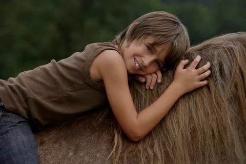 Boy on horseback Stock Photos