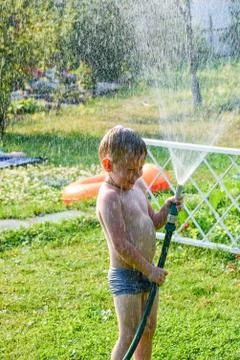 Boy with hose Foto stock