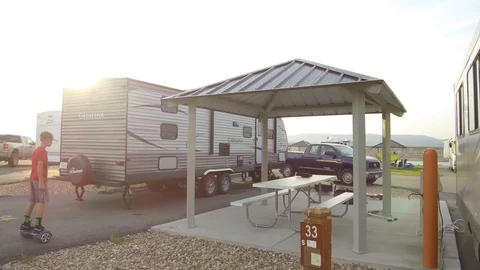 Boy on Hoverboard enters RV Stock Footage 97648431