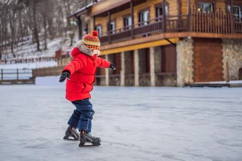 Boy ice skating for the first time Stock Photos