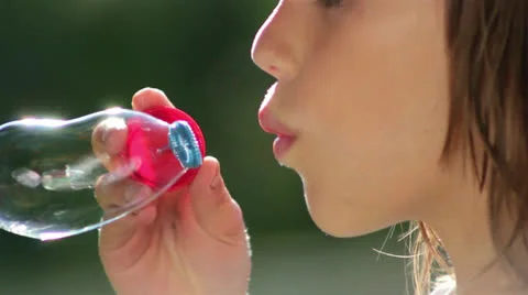 Boy inflates the bubble blower(close-up,profile) Video stock 24961172