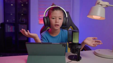 Boy Influencer Talks to Camera With Microphone and Tablet Stock Footage 345426768