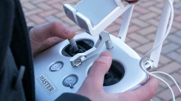 Boy interacting with the drone radio control Stock Footage 85785721