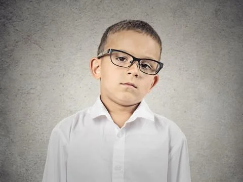 Boy with judgmental face expression Stock Photos