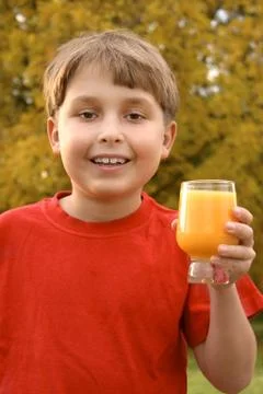 Boy with a juice Stock Photos