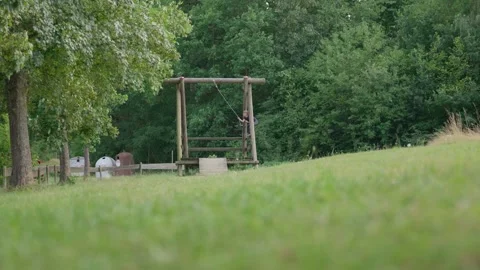 The Boy Jump on a ZIP LINE Rope Swing Low Angle Stock-Footage 345710854