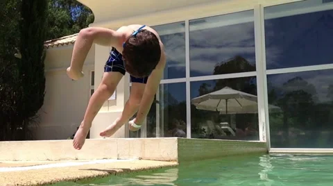 Boy jumping and diving in Swimming Pool. Kids. Slow Motion HD Stock Footage 48671664