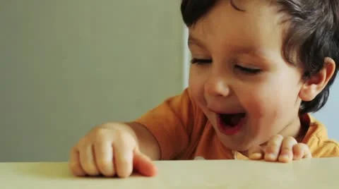 Boy is jumping and eating a nut Stock Footage 22330633