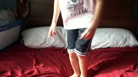 Boy Jumping on Bed 스톡 동영상 12571767