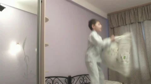 Boy jumping on the bed. Stock Footage 22077051